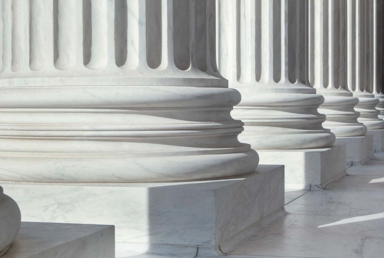 Colonnade of Ionic order columns, close up.