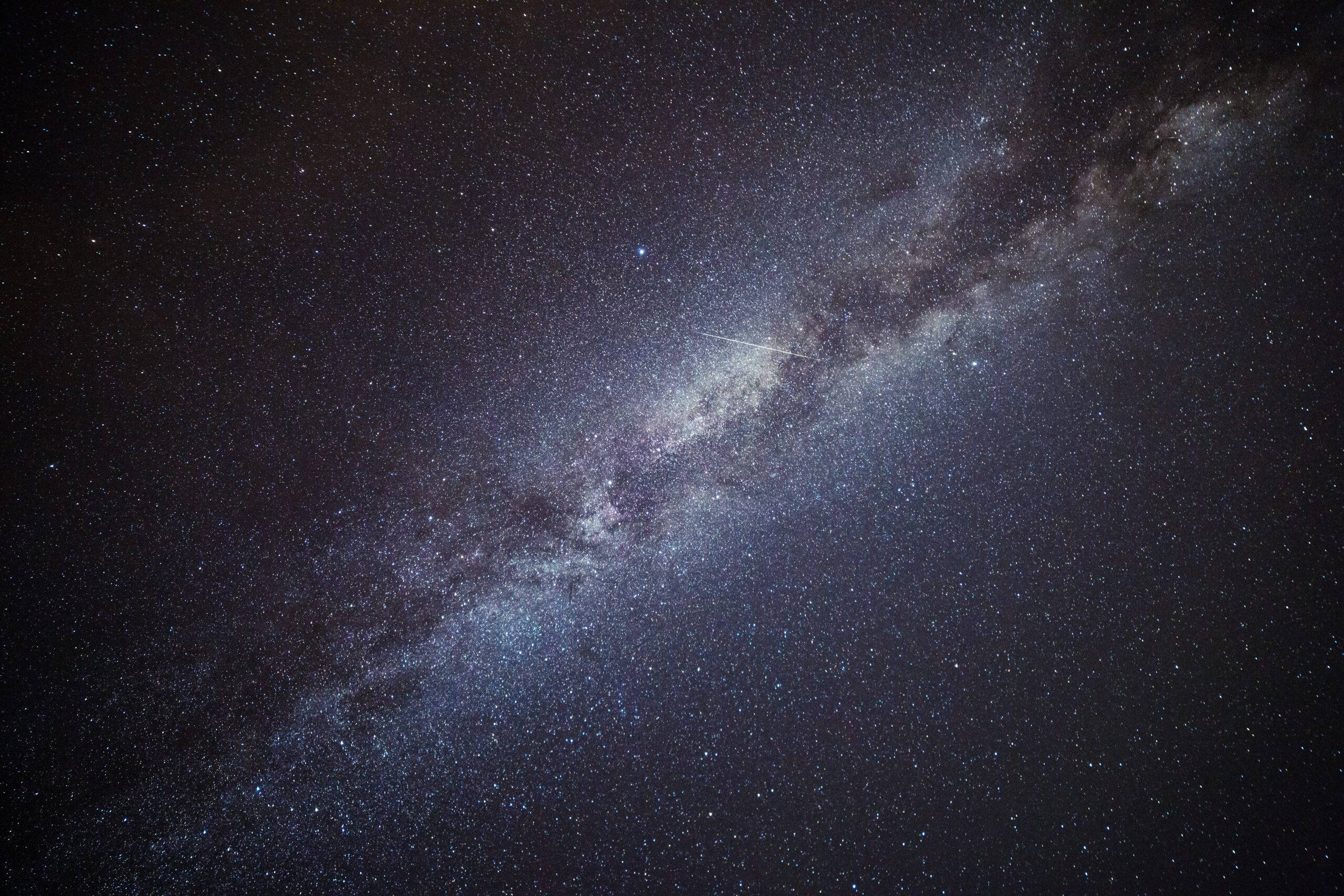 Shooting Star Crossing the Milky Way and Starry Sky