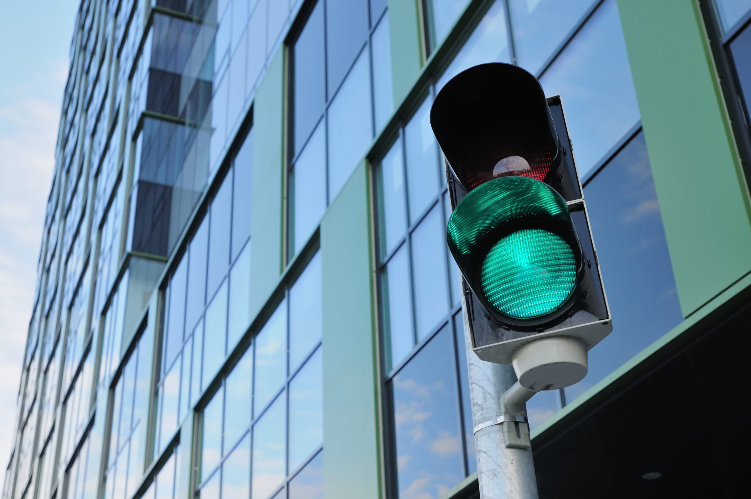 Green light on and red light off on a traffic signaling system that allows cars to get into an underground carpark underneath the business center