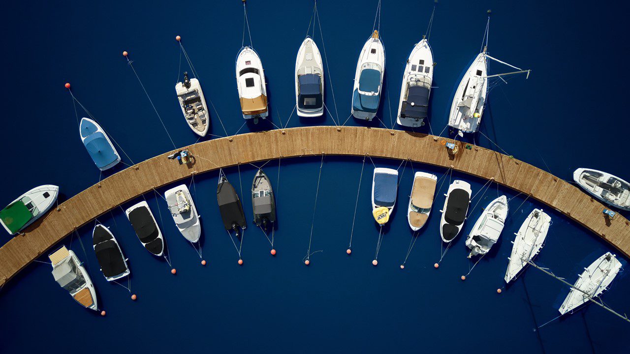 Several boats docked at a marina