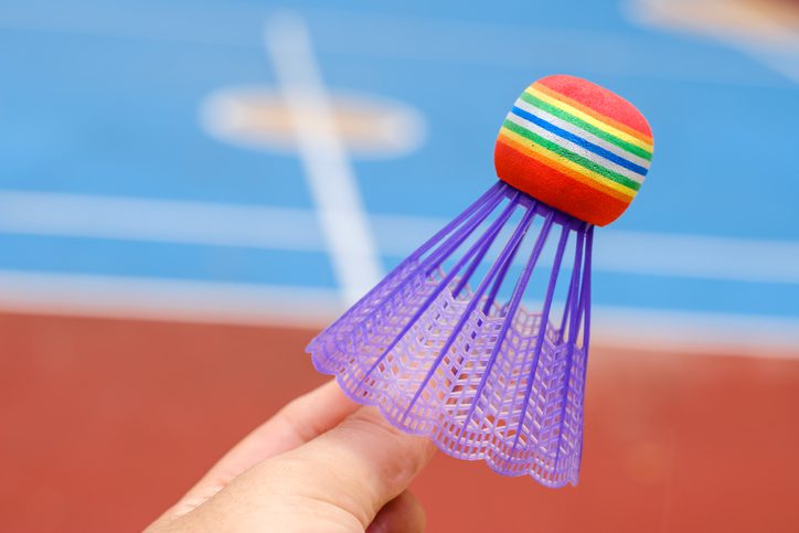 hand hold colorful plastic Badminton in the training ground