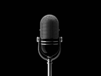 podcast microphone on black background